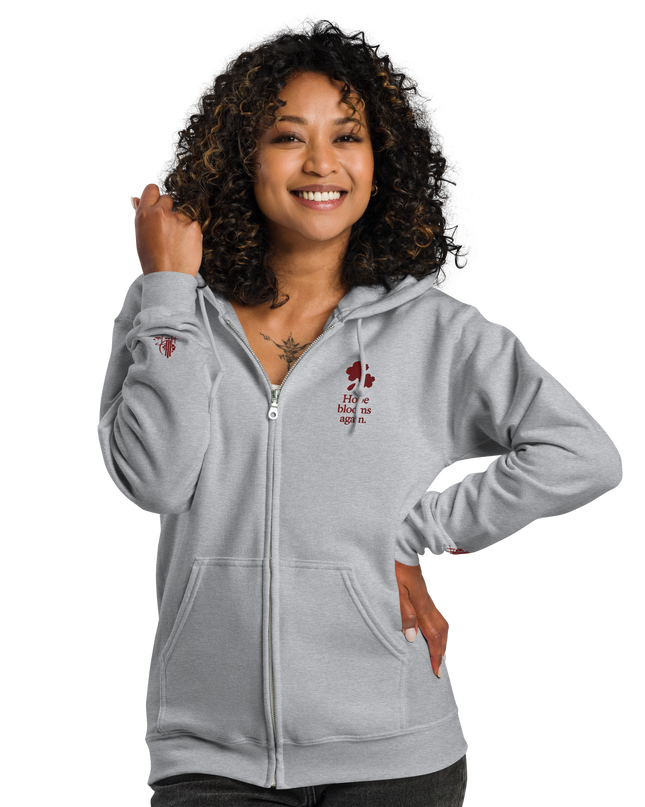 Unisex heavy blend zip hoodie with embroidered theme: Hope Blooms Again