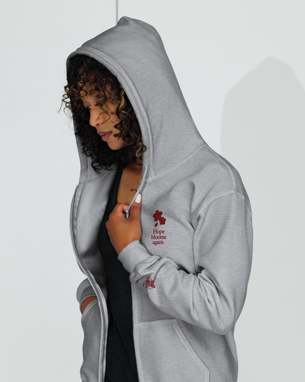 Unisex heavy blend zip hoodie with embroidered theme: Hope Blooms Again